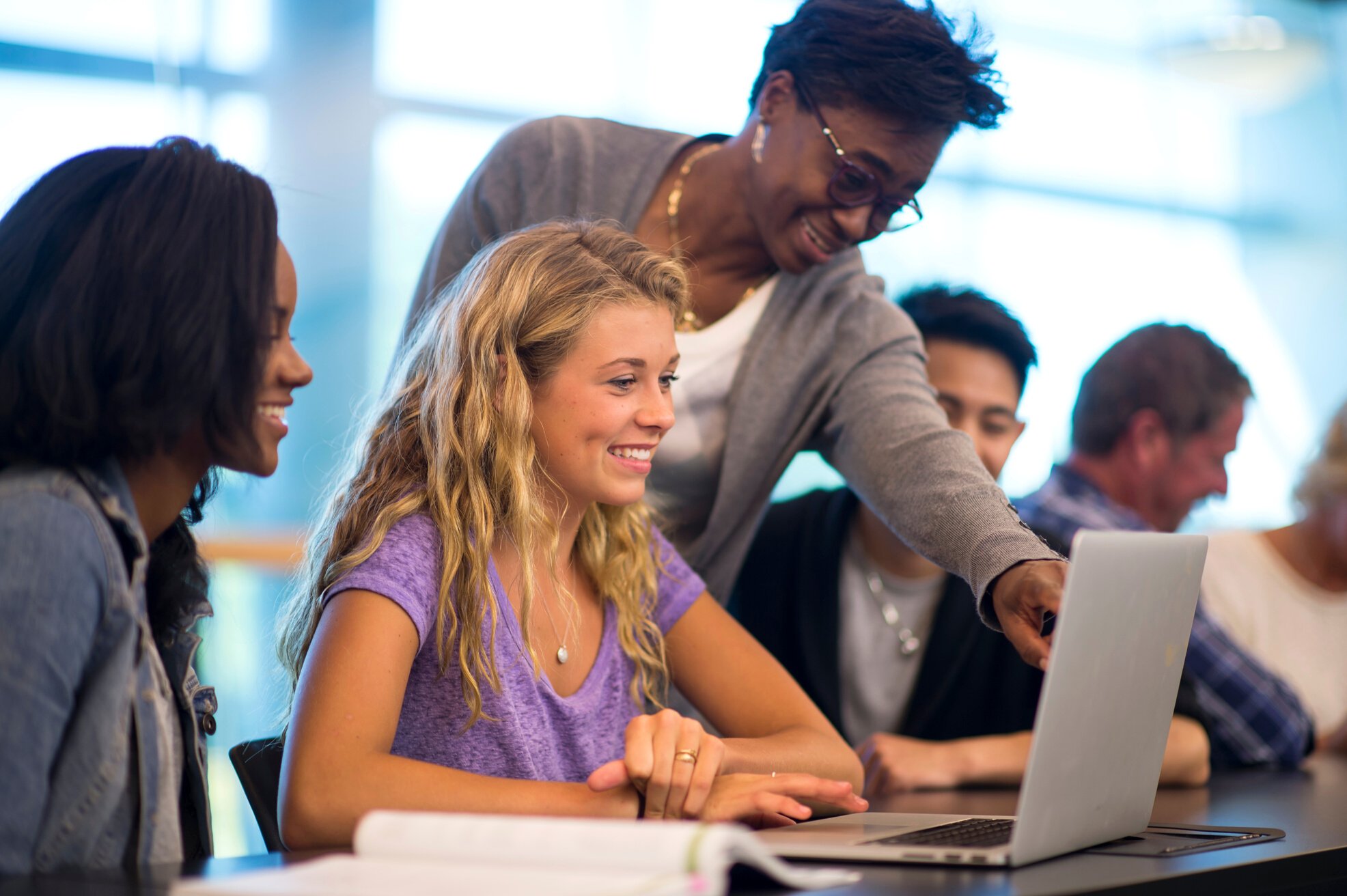 Professor helping students